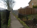 Past the A4174 the route has been built on with new housing as far as West Town Lane. The railings on the right of the footpath follow the boundary of the ex-railway land.