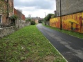 A view along the trackbed in 2006. The route has reverted to use as a transport corridor.