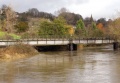 Three photos showing Bradford Viaduct as floodwater swells the River Avon. © John Rawlings