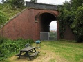 The railway bridge at Wainbrook Drive provided access to allotments. This path has now been closed off and local residents have created a private space for summer barbecues.