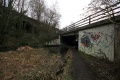 The then disconnected end of the Thames and Severn Canal with Dr Newtons Way passing overhead. The railway viaduct behind. The concrete bridge in the foreground was built as part of the by-pass scheme to enable the canal to be re-opened in the future.