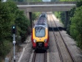 Blasts through and passes under the M5 road bridge on her way north.