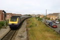 A HST leaves Weston Super Mare station and heads under the footbridge at Langford Road. The rusty track are the remains of the old carriage sidings. © Andrew Ross