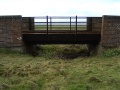 The railway bridge at Chittening Wrath with the Severn Estuary behind.