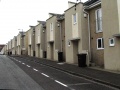 Just to the west of Gordon Road, on Greenbank Road, the railway embankment has been cut back to half its original size and housing built on the route.