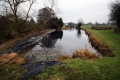 The view east from the end of the canal. The water seems to be kept in place by a giant pond liner!